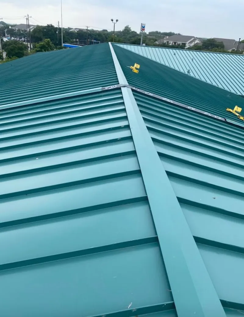 Green commercial metal roof ridge and valley for Metal Roof Repair in Pensacola Station